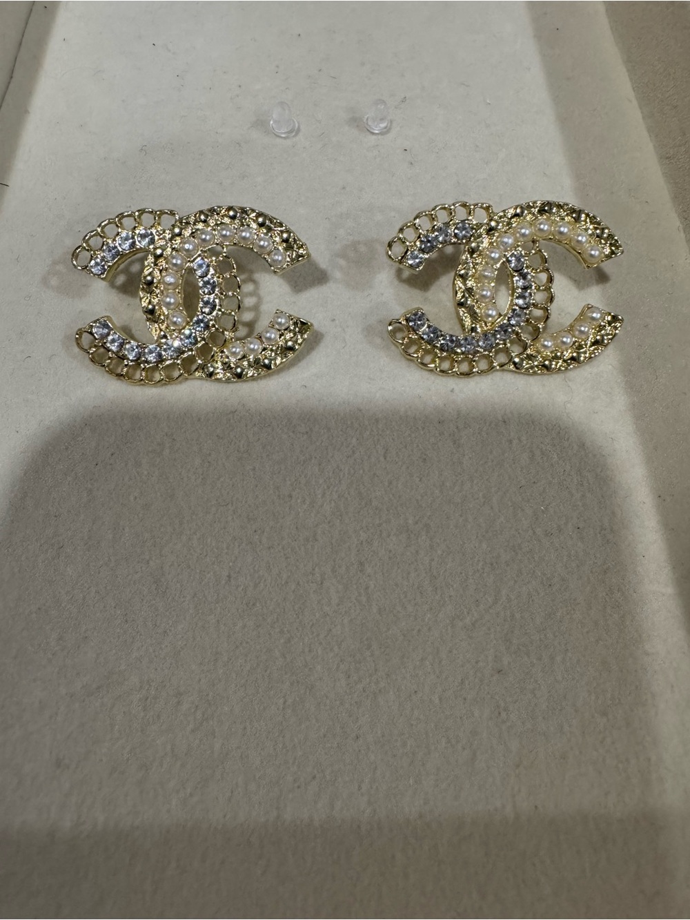 Gold, diamond, and pearled detailed studs